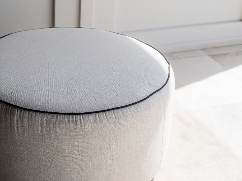 Round Ottoman with Piping