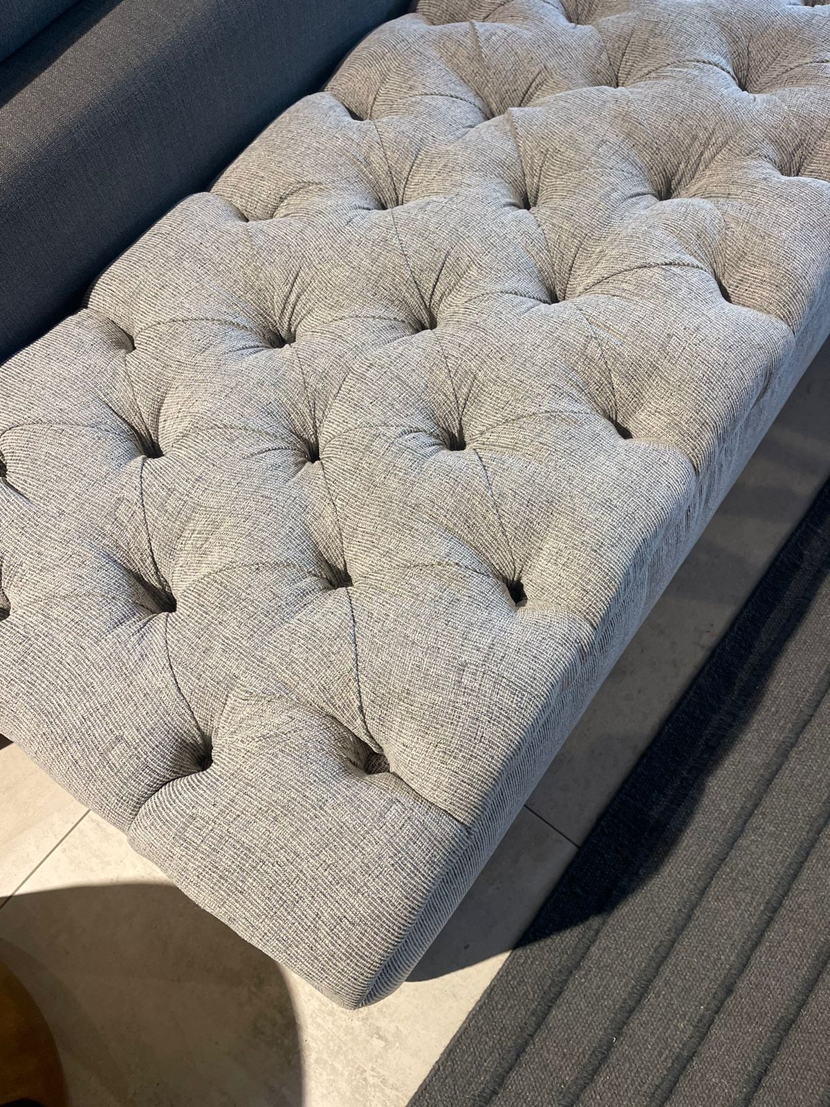 Deep buttoned storage ottoman